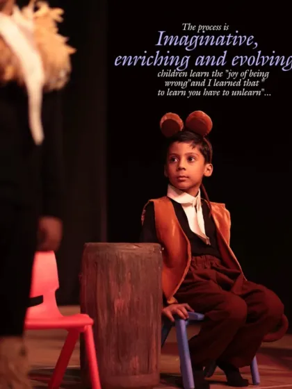 A young actor in costume, deep in character. The process is imaginative and enriching, teaching children that to learn, you sometimes have to unlearn.