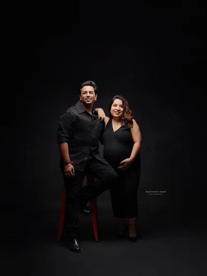 A stylish and confident pose from the parents-to-be. This shot has a modern and cool vibe, perfect for capturing your personality as a couple.