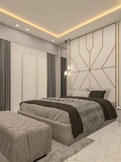A 3D render of a luxurious bedroom with a geometric-patterned accent wall in white and gold. The room is furnished with a plush bed, a comfortable bench, and mirrored panels that enhance the sense of space.