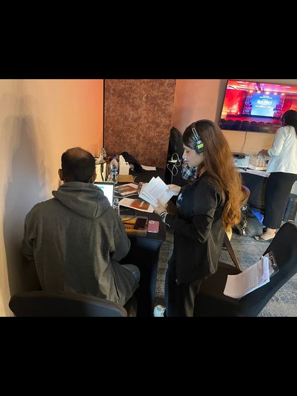 Our show caller coordinating with the technical team from a backstage console at the 'Delhi Crime' launch.