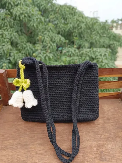 A different angle of the black shoulder bag, showing how the charm hangs beautifully. All my bags are fully customizable for bulk orders.