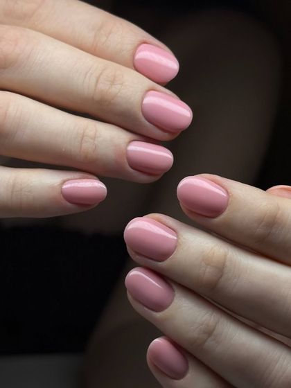 A soft, dusty rose pink manicure. This understated and elegant color is perfect for a professional yet feminine look.