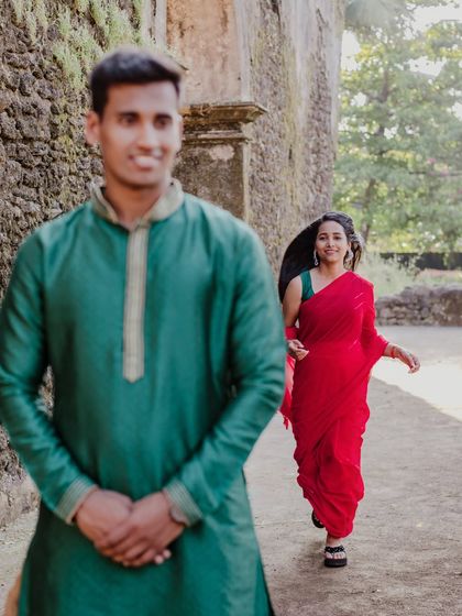 A playful moment of hide-and-seek among the ruins. This candid photo captures the fun and anticipation in their relationship.