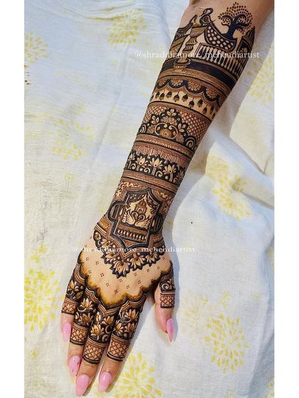 A single arm view of a bridal design, showing a beautiful jharokha and lotus patterns. The top features a swan in a royal palki.