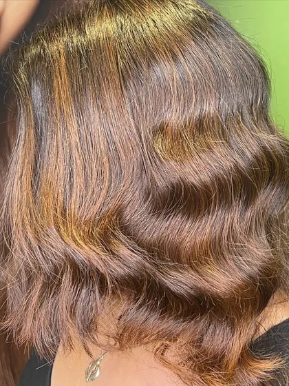 A side view of the caramel highlights, showing how the color beautifully frames the face.