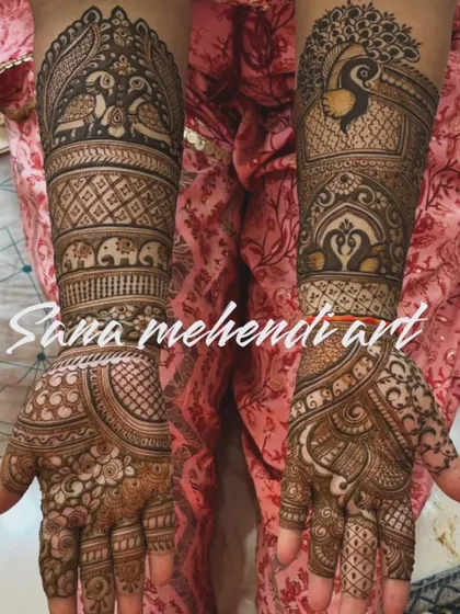 A beautiful example of asymmetrical bridal mehendi. While the core elements like peacocks and elephants are on both hands, the supporting patterns are different, creating a unique look.