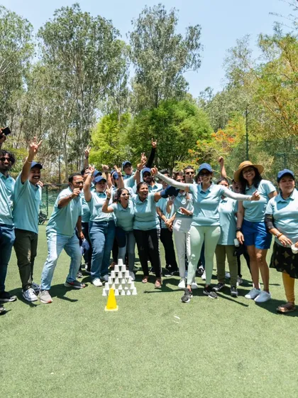 The pure joy of victory. A corporate team celebrates after successfully completing a team building challenge.