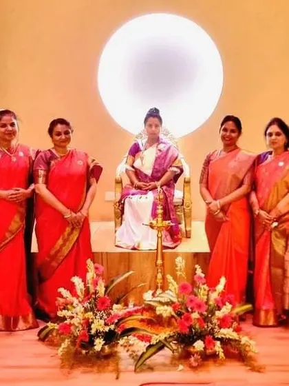 Maa Aditiji poses with a group of women at our Bangalore centre, highlighting the strong and supportive female presence in our spiritual community.