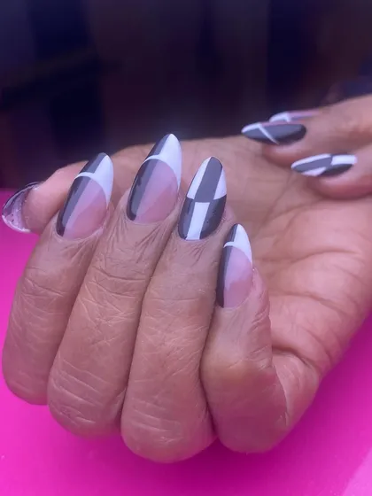A bold, graphic design in black and white. The geometric patterns create a modern and eye-catching look that is both chic and artistic.