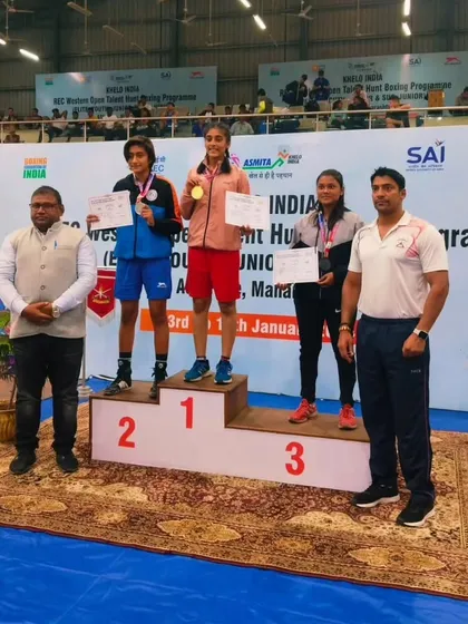 Our champion Nishi Patel on the winner's podium, taking the number one spot. We train our athletes to aim for the top.