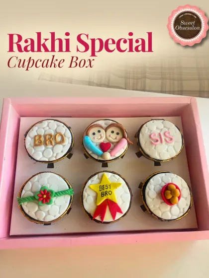 This Rakhi Special Cupcake Box contains six themed cupcakes. The designs include "BRO," "SIS," a fondant Rakhi, and a "Best Bro" star, making it a fun and delicious gift.