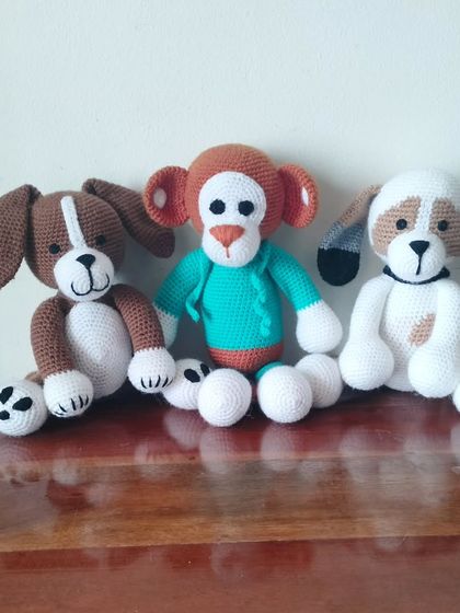 A group of my larger stuffed animals, including two dogs and a monkey. These are great for big hugs.