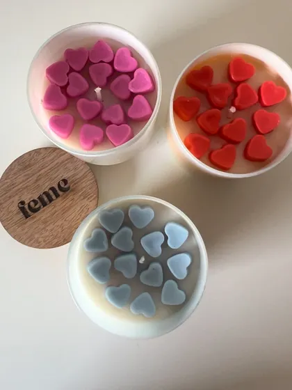 Our jar candles topped with colorful heart wax melts. This special touch makes them a lovely gift for Valentine's Day or any day.
