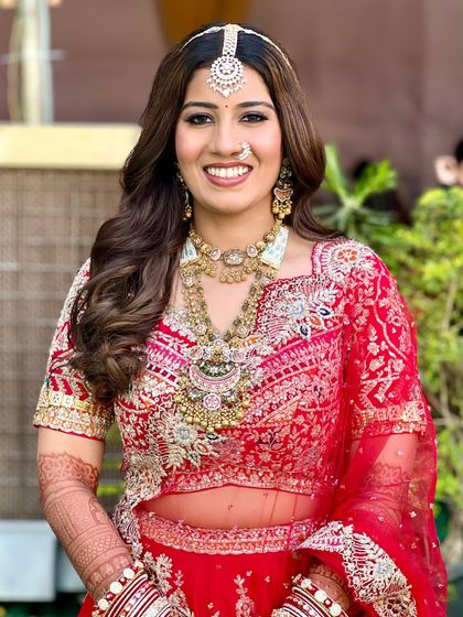 A beautiful, happy bride. We kept Bhavi's makeup classic and elegant, with soft curls and a focus on radiant skin to let her natural beauty shine through.