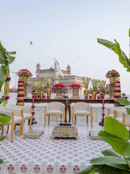 A closer view of the mandap for Vijayshree and Omkar's wedding at the Taj Mahal Palace. The design incorporates traditional elements like banana trees and marigold pillars, creating a sacred space with a spectacular backdrop.