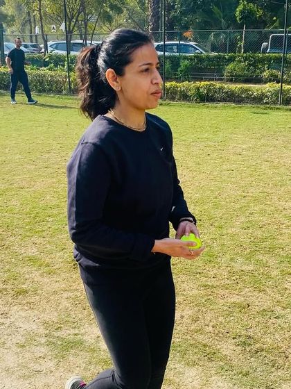 Parents are a huge part of our community. Here, a mother participates in a fun match, showing her support and love for the game.