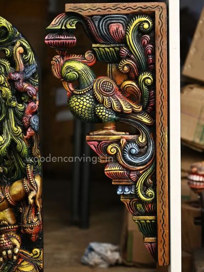 A close-up of the 24-inch multicolored Annapakshi (Hamsa bird) wall bracket, showcasing the vibrant painting and detailed carving of the mythical bird.