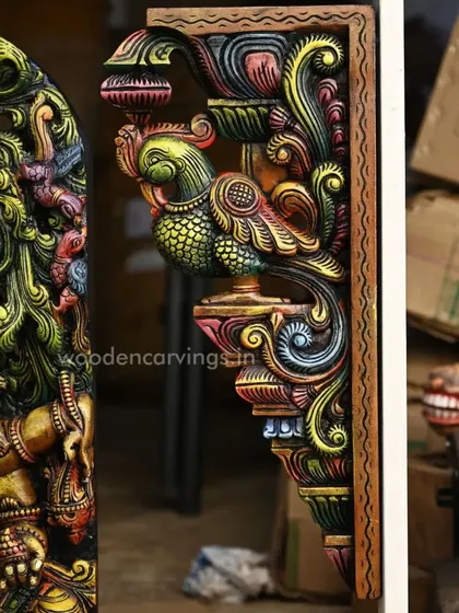 This image shows the colorful Annapakshi bracket from the side, highlighting how the vibrant colors are applied to every surface, creating a fully realized, three-dimensional piece of art.