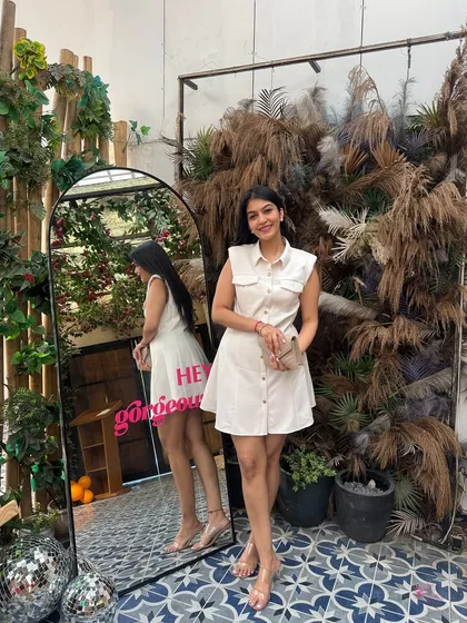 A confident pose in the white dress. This is the kind of simple, classic, and reusable piece I love finding for my clients' wardrobes.