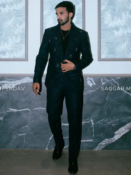 A full look of Shakti Yadav in our dark blue suit, combining military-inspired details with a sophisticated edge.