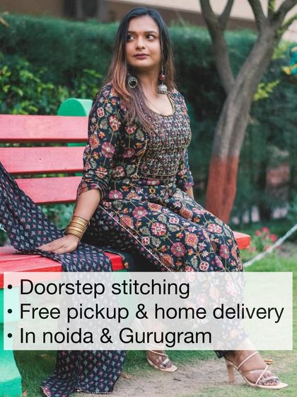 A client seated in a park wearing her custom-printed suit. Our doorstep stitching service makes getting tailored clothes easy and convenient.