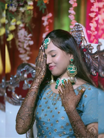 A lovely candid shot of the bride admiring her henna. These are the moments I cherish.