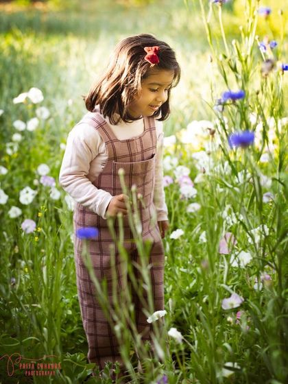 A little explorer in a field of wildflowers. Letting children wander and play is the best way to capture their natural spirit and create authentic portraits.