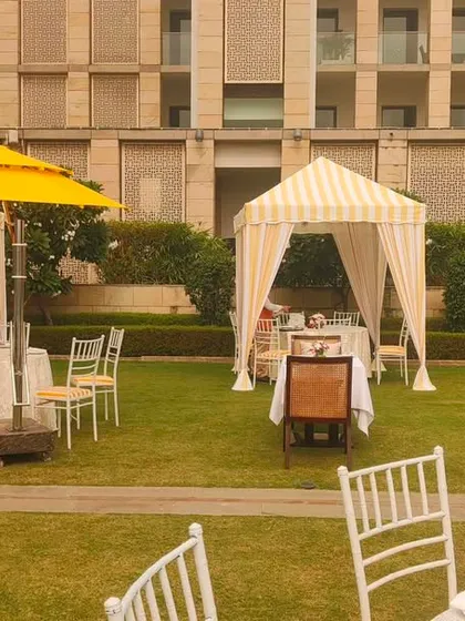 Another view of the outdoor brunch setup, showing the arrangement of private cabanas and tables with bright yellow umbrellas. I design layouts that are both beautiful and functional.