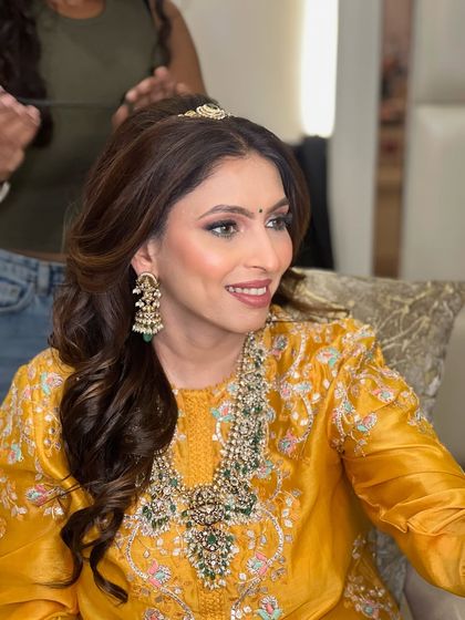 Radiant in tradition for Teej. This client is wearing a stunning yellow Anamika Khanna outfit, and we created a soft, elegant makeup look to match.