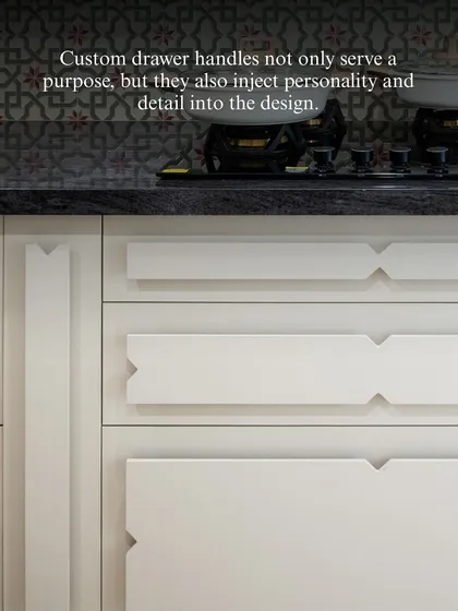 Custom drawer handles are an opportunity to inject personality and detail into a design. These unique, geometric handles serve their purpose while also acting as a subtle, artistic element in the kitchen.
