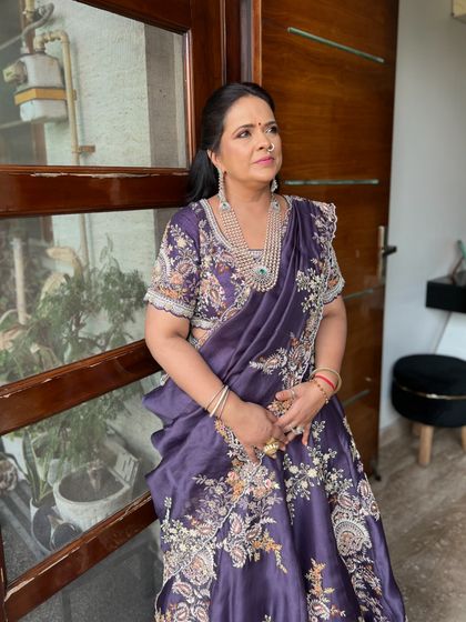 Styling the mother of the groom. She wanted something comfortable yet elegant, so we chose this stunning purple lehenga with intricate resham embroidery. An off-beat color that she pulled off beautifully.