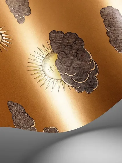 A swatch of the Soli e Nuvole wallpaper in a warm gold colorway. The iconic Fornasetti design, featuring personified suns peeking through clouds, adds a touch of artistic and historic charm.
