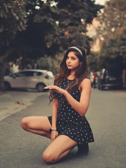 We shot this right in the middle of the street. The out-of-focus background with cars and trees gives it a real-world, spontaneous feel that I love.