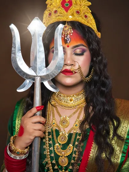 A serene yet powerful pose with the trishul, showcasing the student's ability to direct and capture a character.