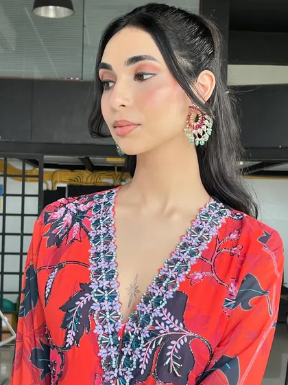 The focus here is on luminous, healthy-looking skin. I use specific skin prep and highlighting techniques to achieve this radiant, lit-from-within glow.
