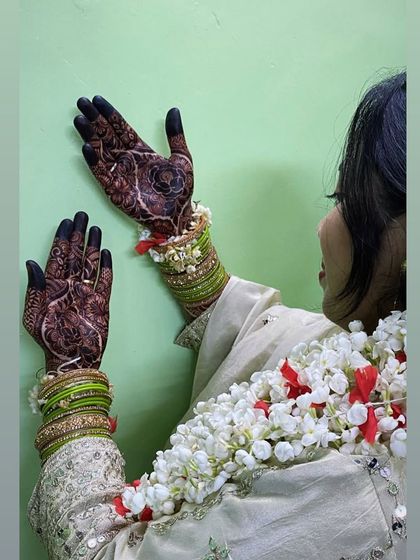 A candid shot of the bride showing off her beautiful henna.