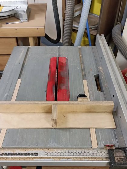 The mini crosscut sled in place on the table saw. The runners in the miter slots ensure it slides smoothly and perfectly straight.