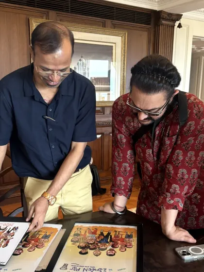 Reviewing the final prints of the "Sitaare Zameen Par" character series with Aamir Khan ji.