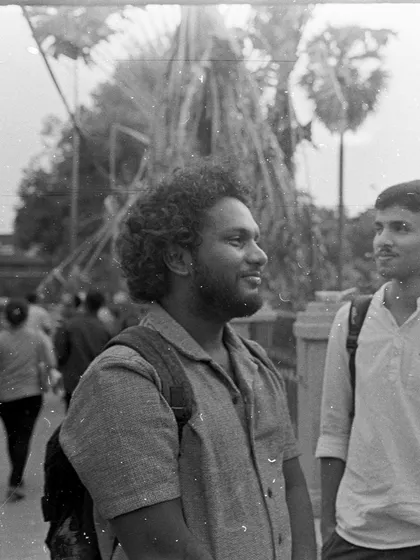 A candid portrait shot on black and white film. This entire roll was accidentally overexposed but salvaged in the darkroom by our expert, Krishanu, using a 'pull' processing technique.