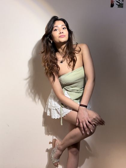 You go girl. This sage green tube top is a summer essential. It's simple, chic, and can be paired with almost anything.