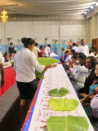My team ensures every guest has a fresh banana leaf placed before them. This is the first step in our traditional South Indian meal service.