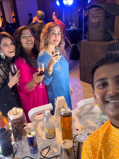 A group of friends enjoying their drinks at a Diwali party. We love seeing guests connect and have a great time around our bar.