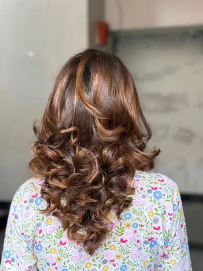 The stunning "After" result. Our students learn how to create seamless color blends and finish with a professional-quality style.