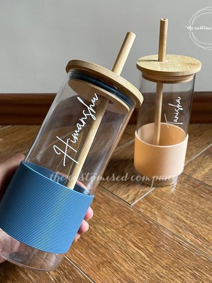 Elevate your hydration game with this custom glass tumbler. The combination of the glass body, bamboo lid, and colored silicone sleeve makes it a thoughtful and delicate gift choice.