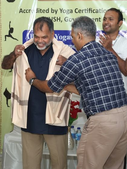 A traditional gesture of respect as our chief guest is honored with a shawl by a member of our team.