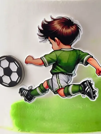 A close-up of the football-themed cake, showing the detailed player cutout kicking a soccer ball. It’s all about the little details that bring the action to life.