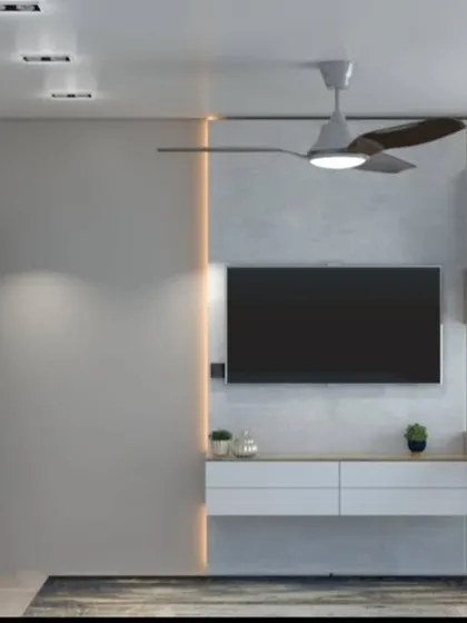 A minimalist bedroom with a floating TV console and study desk. The design is clean, functional, and perfect for a contemporary home.
