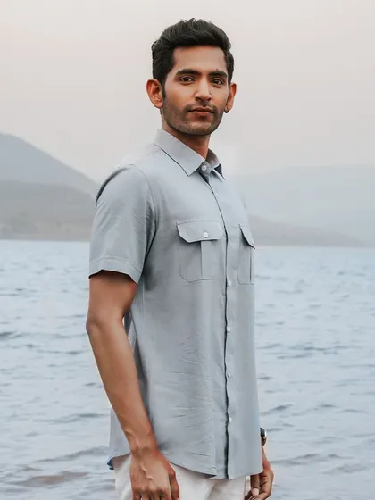 The 'Soaring Whale' shirt, seen from the side. Made from 100% natural bamboo fabric with corozo nut buttons, its timeless pattern and elegant design make it a classic choice for any adventurer.