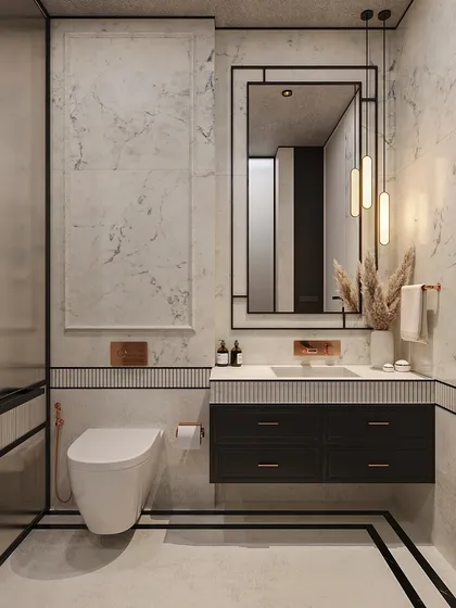 The marble walls are framed with subtle molding, a detail that elevates the space and connects it to the classical design of the adjoining bedroom.