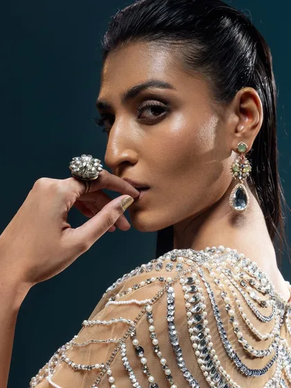 This close-up from the Kavita Arora campaign focuses on the beauty and detail. The shot highlights the intricate beadwork on the shoulder of the garment, paired with statement jewelry, showcasing my eye for detailed accessory styling.